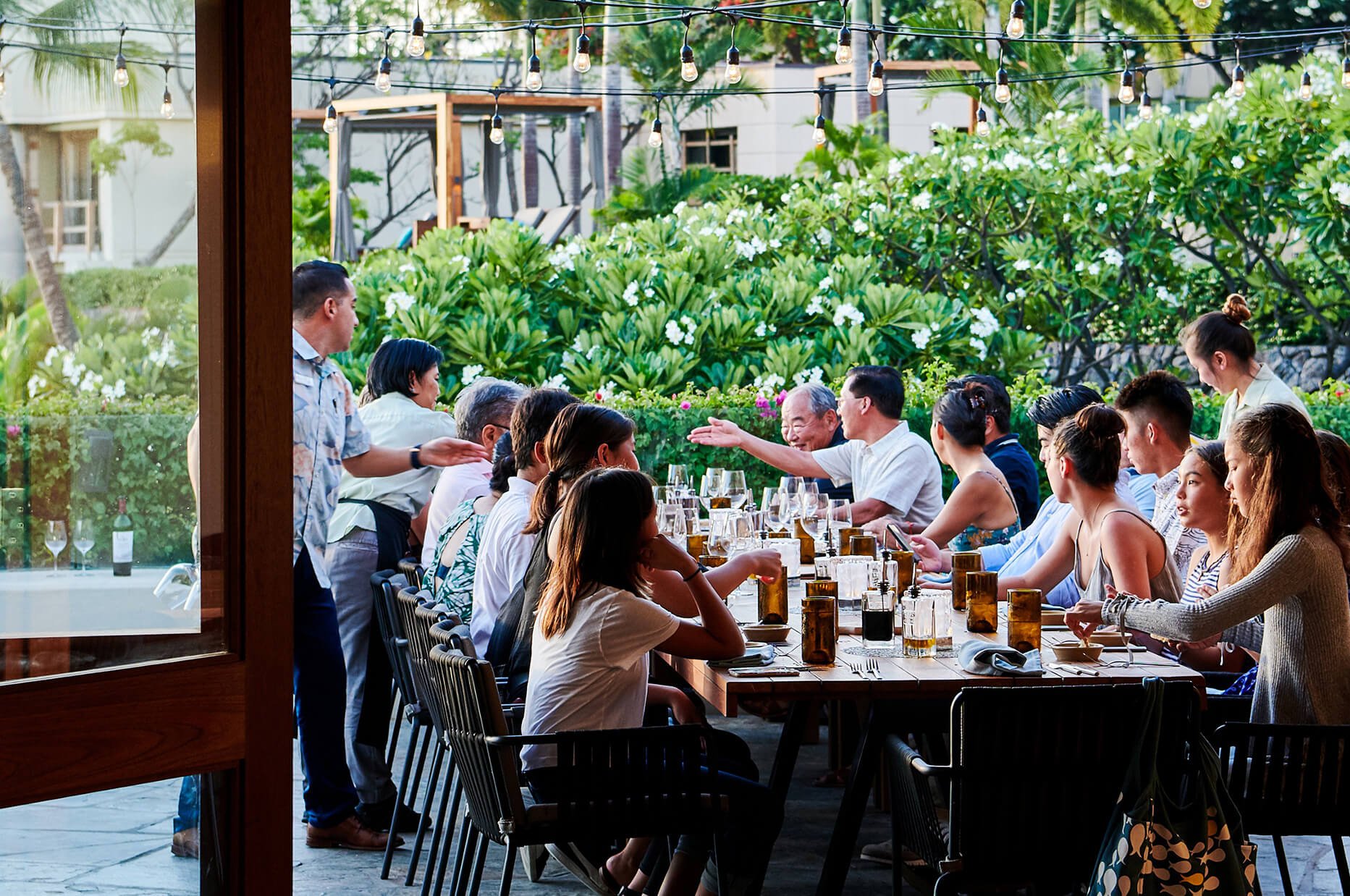 A large group dining outdoors