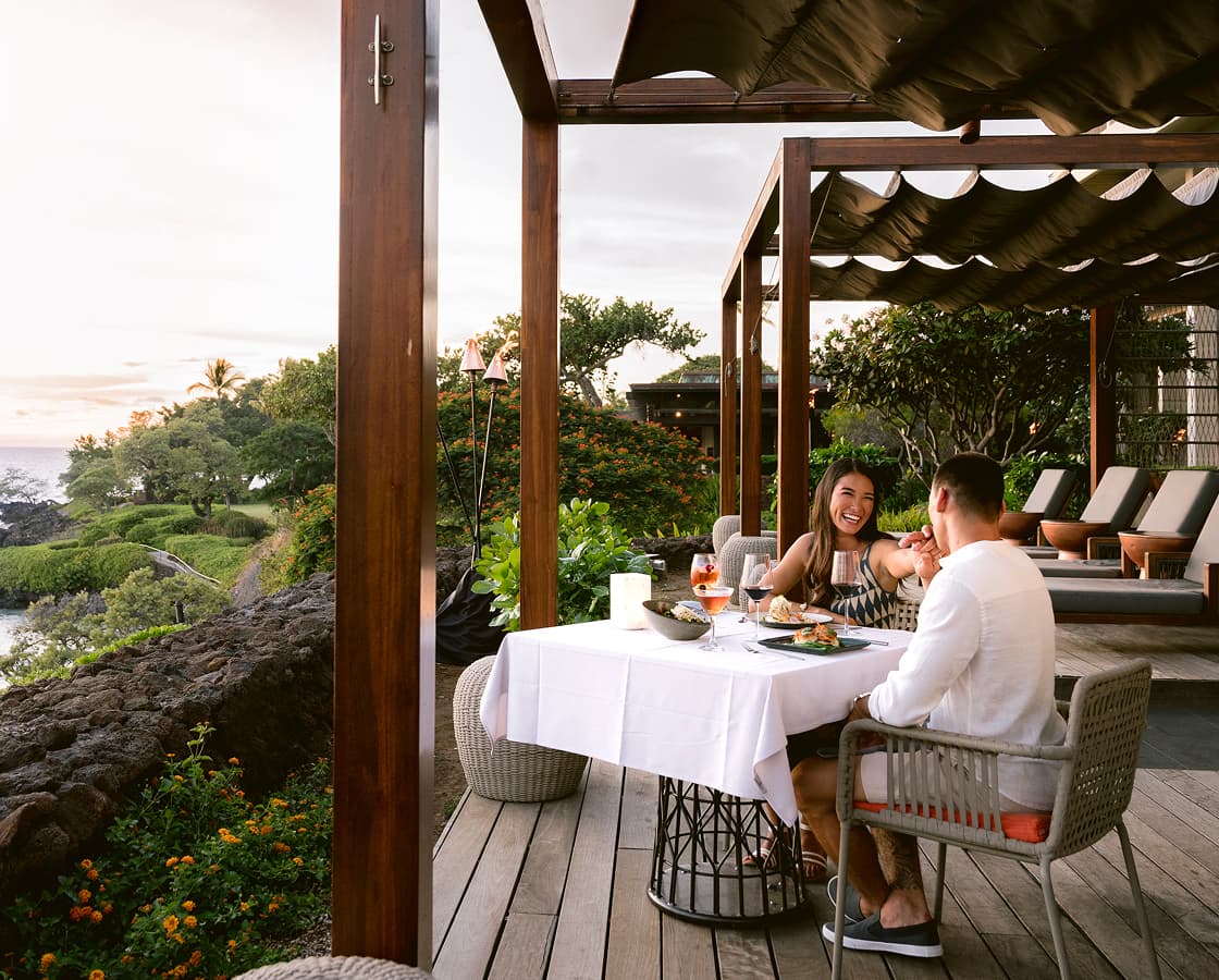A couple dining on the deck